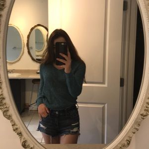 Teal long sleeve shirt.